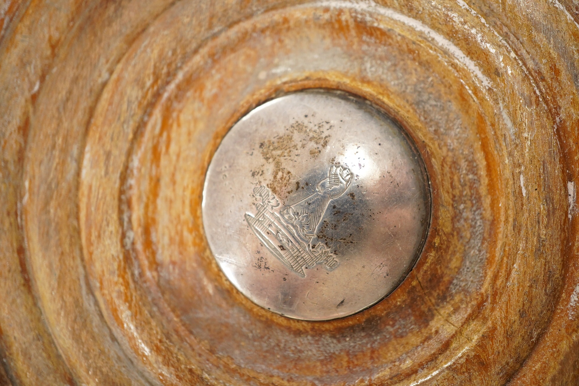 A pair of George III silver wine coasters, by John Roberts & Co, with gadrooned borders and turned wooden bases, Sheffield, 1810, diameter 15.9cm. Condition - poor